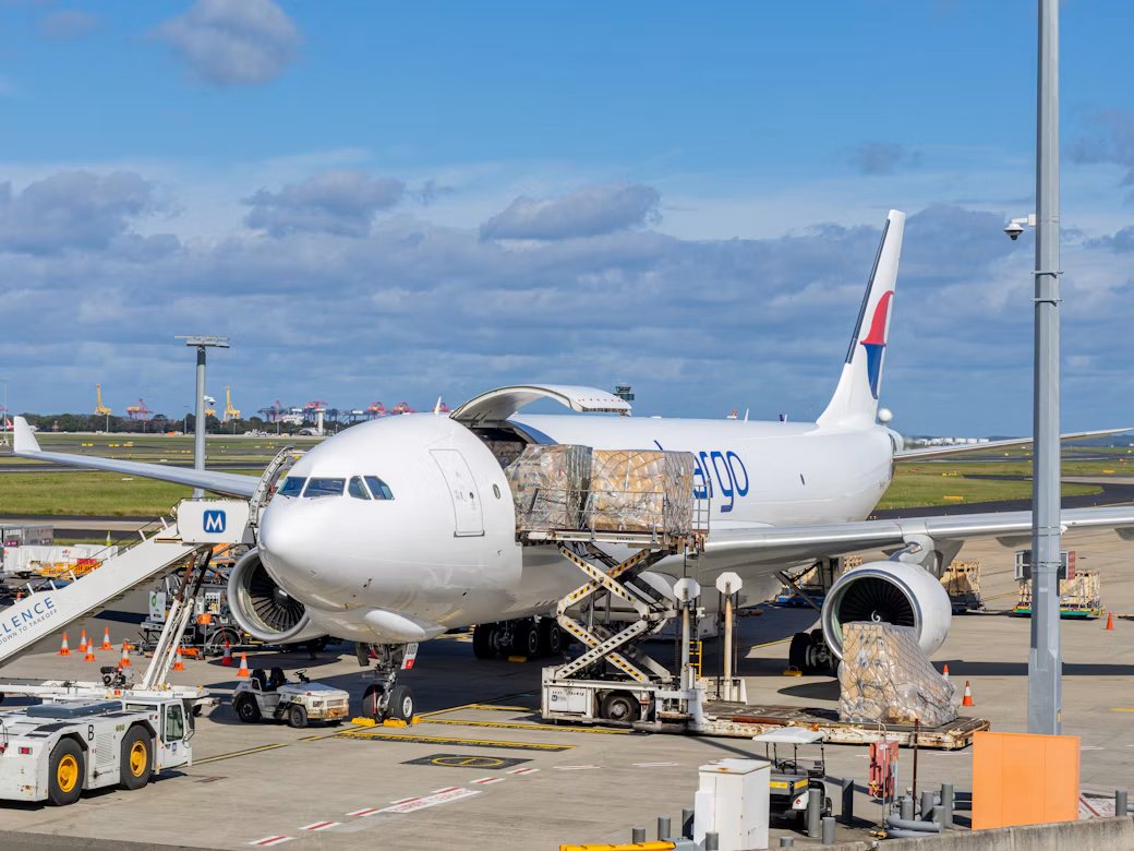 Cargo aircraft being loaded at the airport
